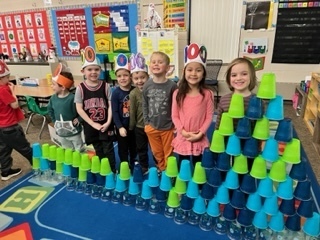 Kids stacking cups.