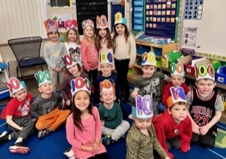 kids wearing paper crowns. 