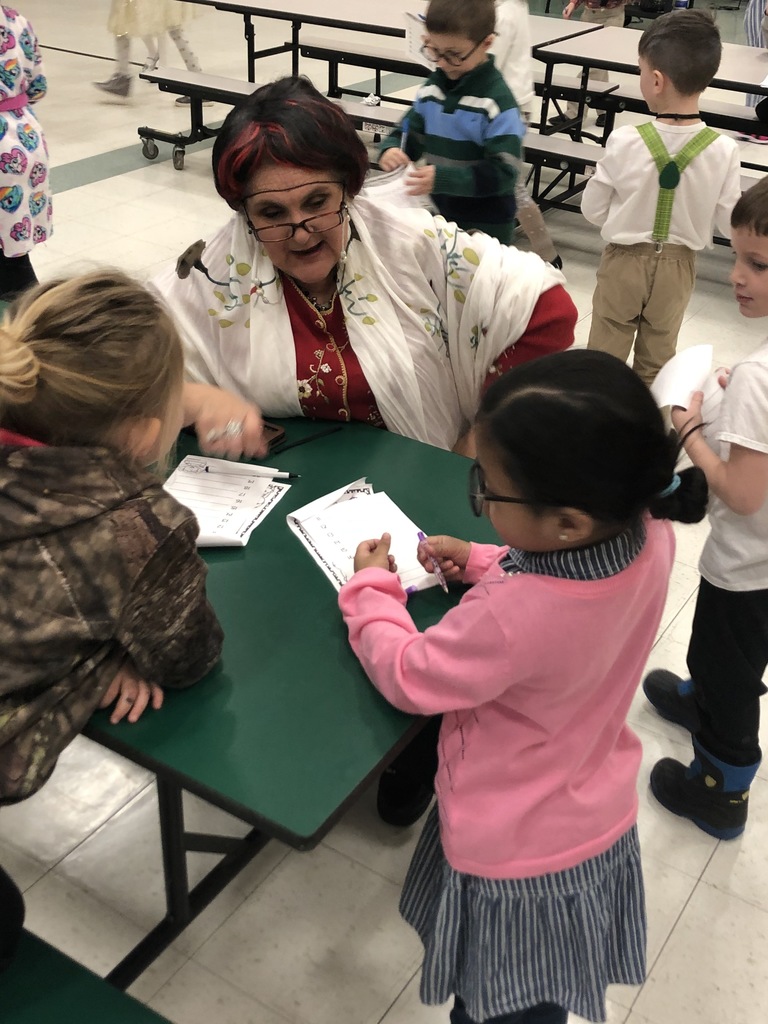 Kindergarten students collecting 100 autographs on the 100th day of school.